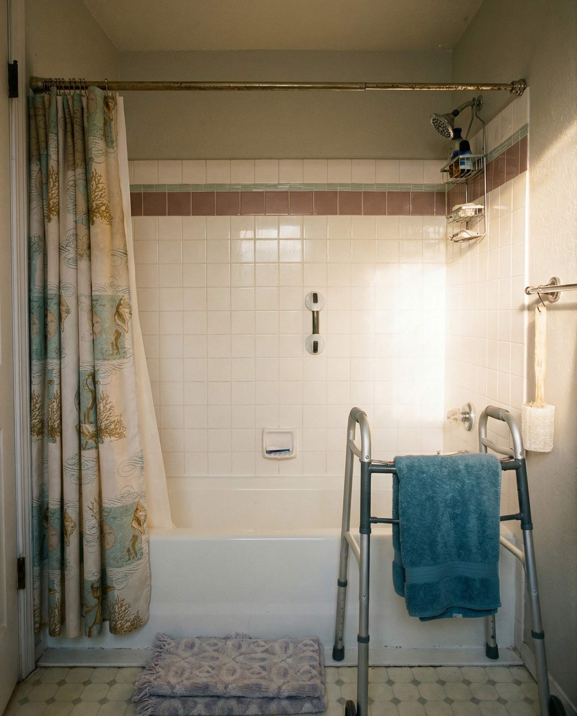 Bathroom before remodel - outdated tub with shower curtain